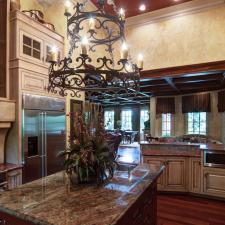 Wood grained ceiling tuscan plaster walls against warm glazed cabinetry